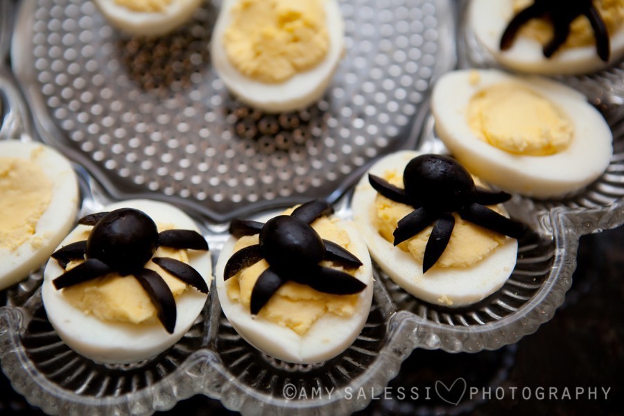 deviled eggs with spiders made out of olives
